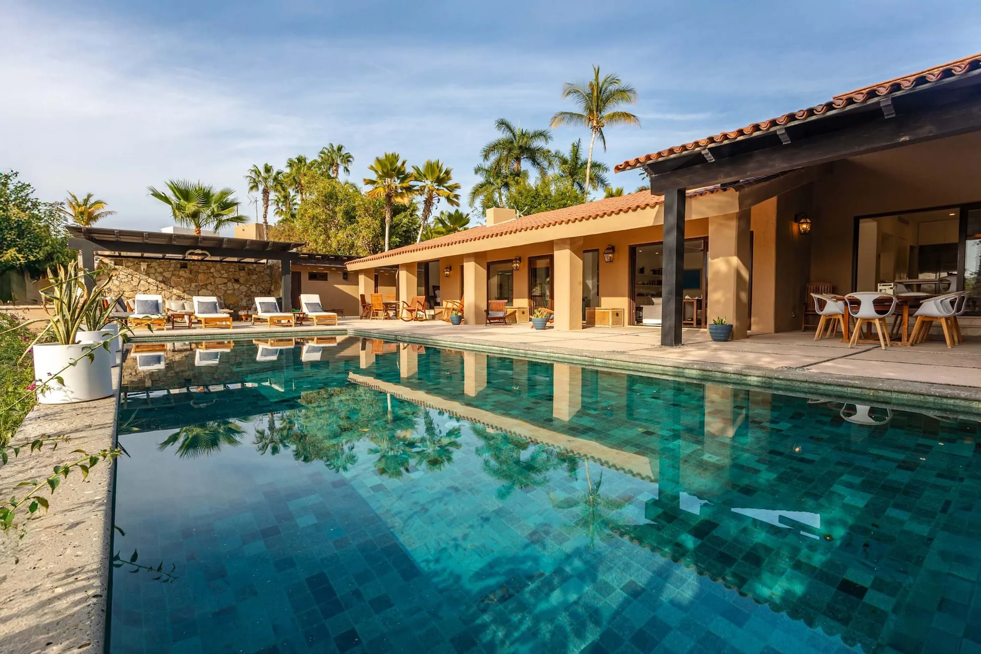 The private pool and terrace at the Cabo Real house, under the palms