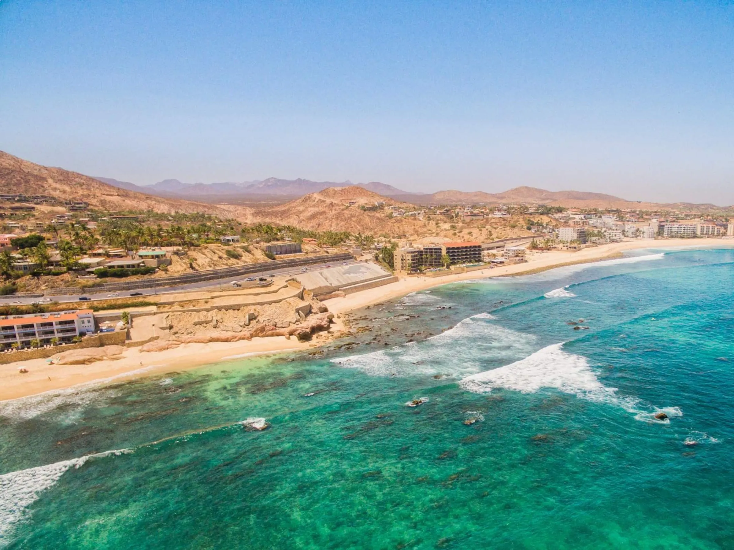 The Costa Azul coastline from above, the surf break and the beach below