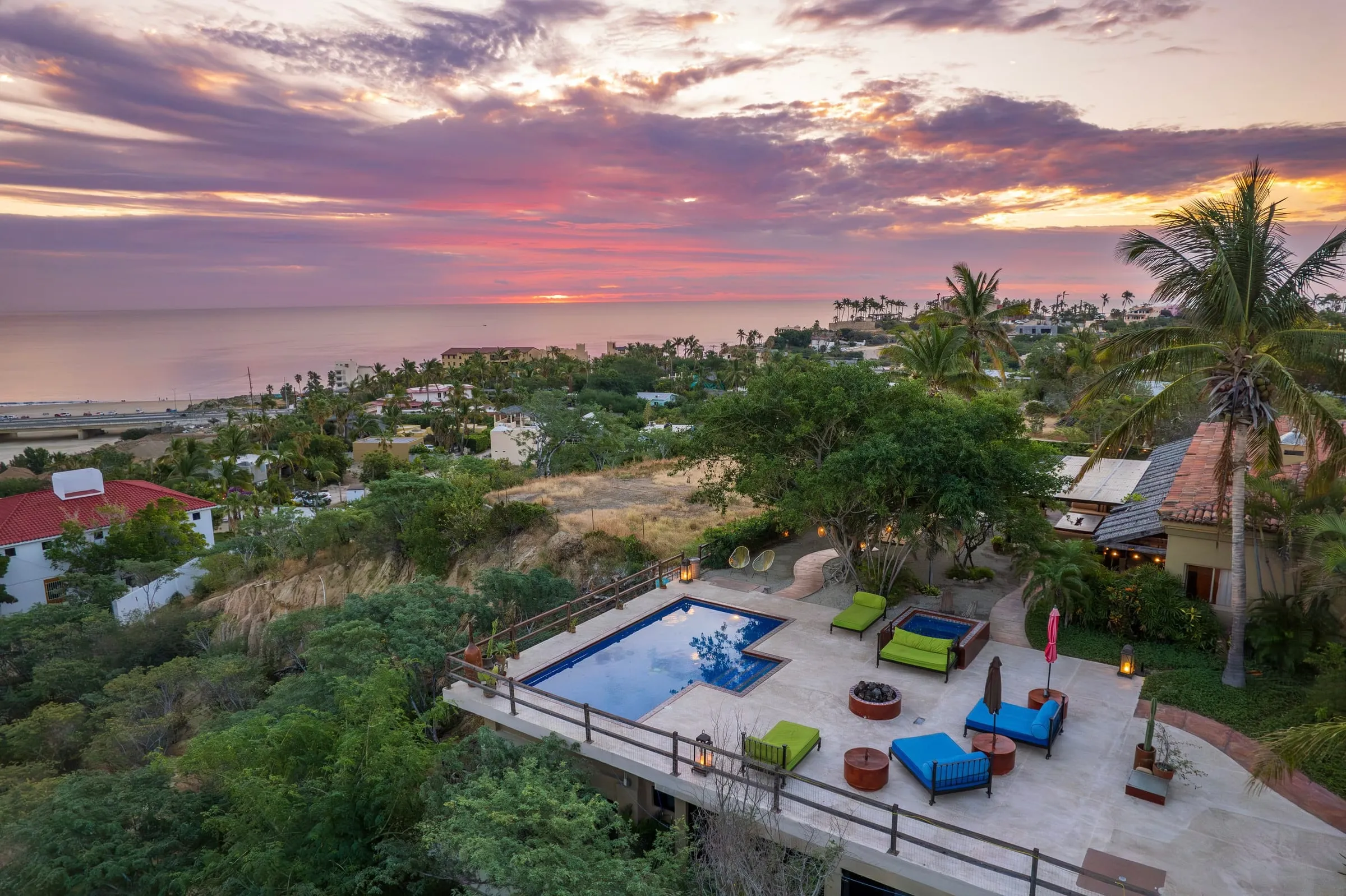 The pool and terrace at dusk, with Costa Azul and the sea below